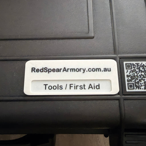 Black tool box with 'RedSpear Armory' label and QR code on a wooden surface
